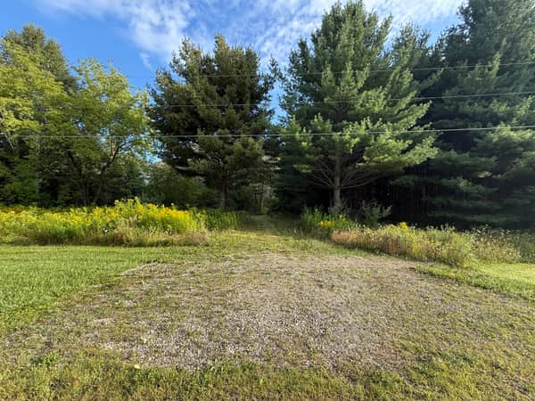 The installed stone apron at the front of the property, providing finished access from the road.